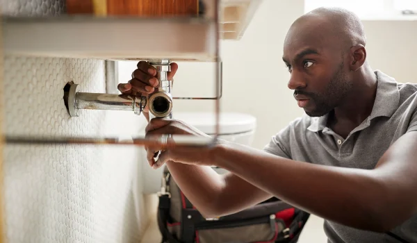 male plumber fixing a bathroom faucet from Plumber Pflugerville in Pflugerville, TX - Pflugerville, TX male plumber fixing a bathroom faucet from Plumber Pflugerville in Pflugerville, TX - Pflugerville, TX